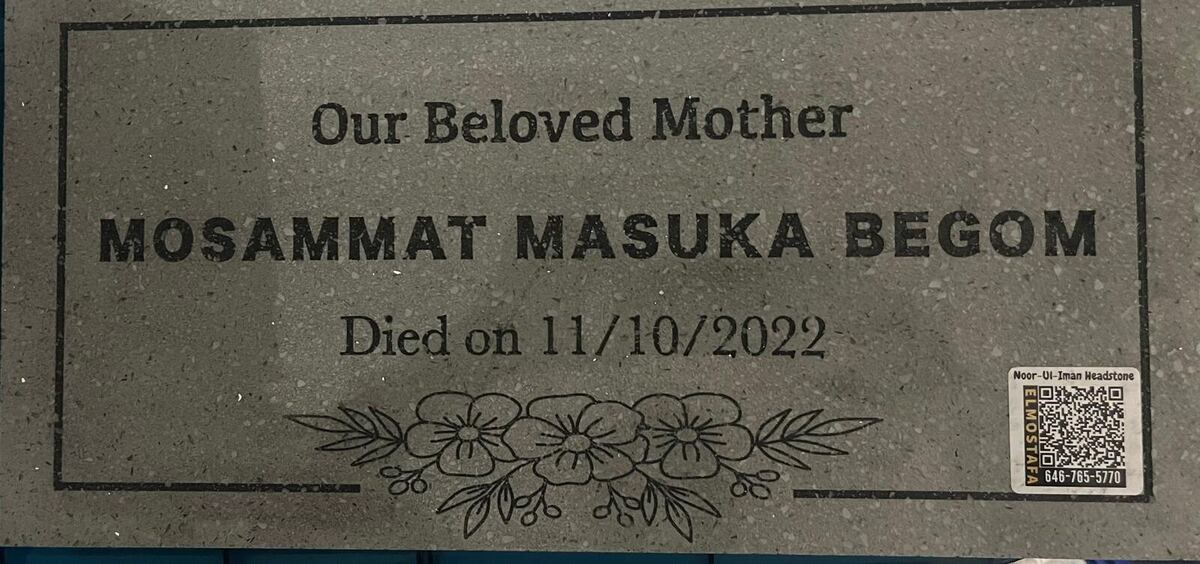 Grey terrazzo headstone with a hand-engraved floral border