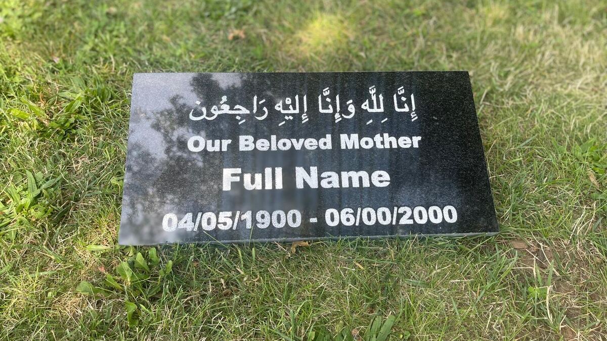Polished black granite marker with white lettering