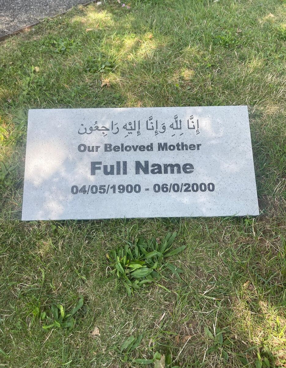 White terrazzo flat marker set in the lawn