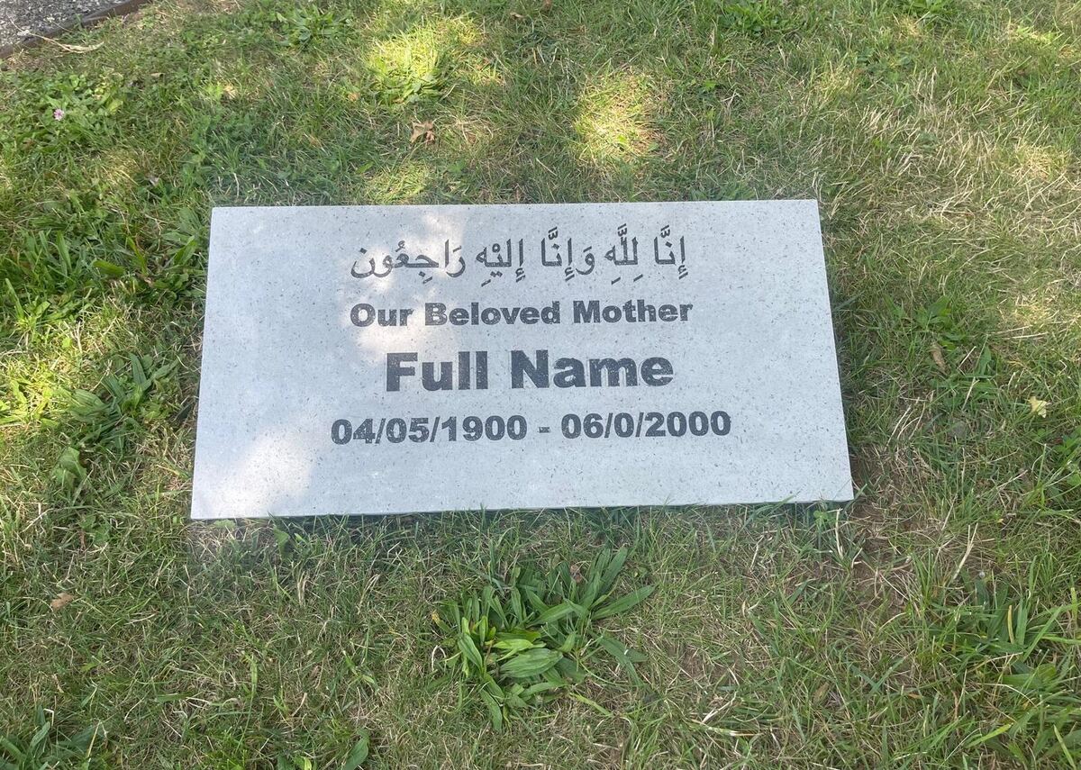 White terrazzo marker at a graveside setting